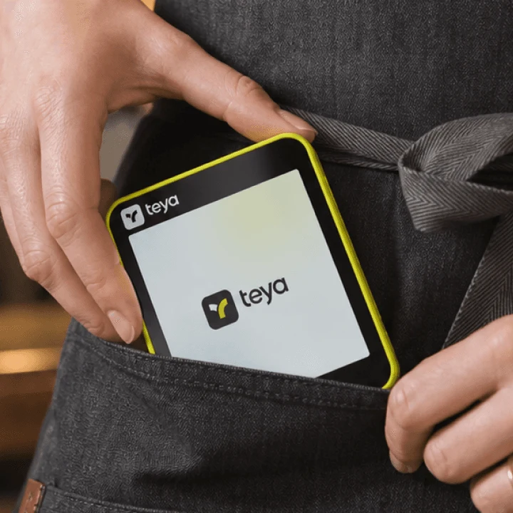 Teya Lite slipping into an apron pocket