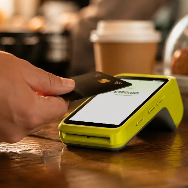Customer paying by card on a handheld Teya Pro card machine